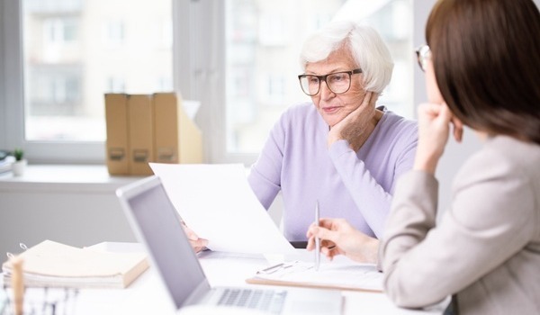 https://4053673.fs1.hubspotusercontent-na1.net/hubfs/4053673/older%20woman%20reviewing%20insurance%20policy%20with%20agent.jpeg